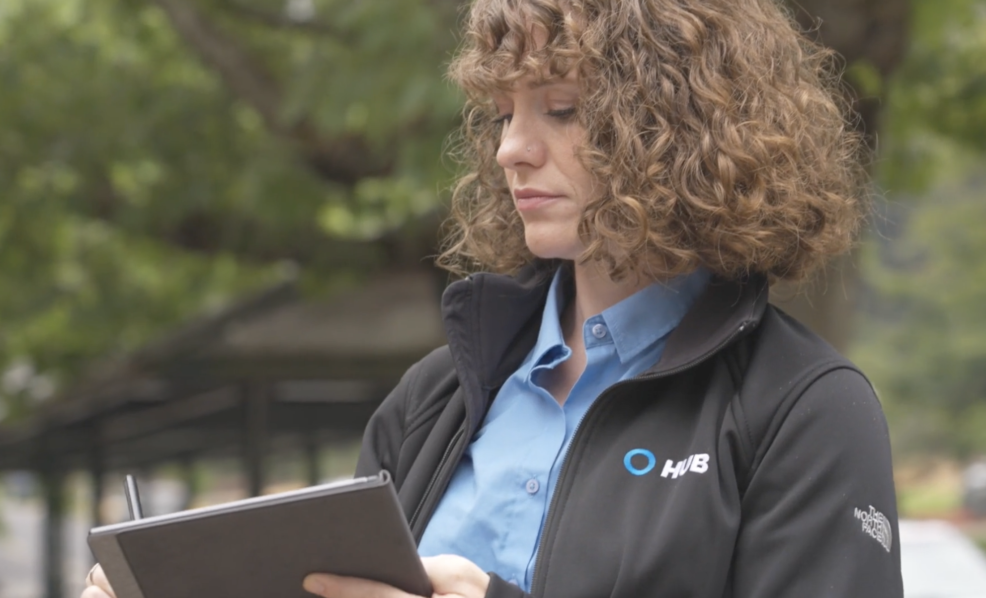 HUB Team Haugen advisors reviewing a client program on a tablet